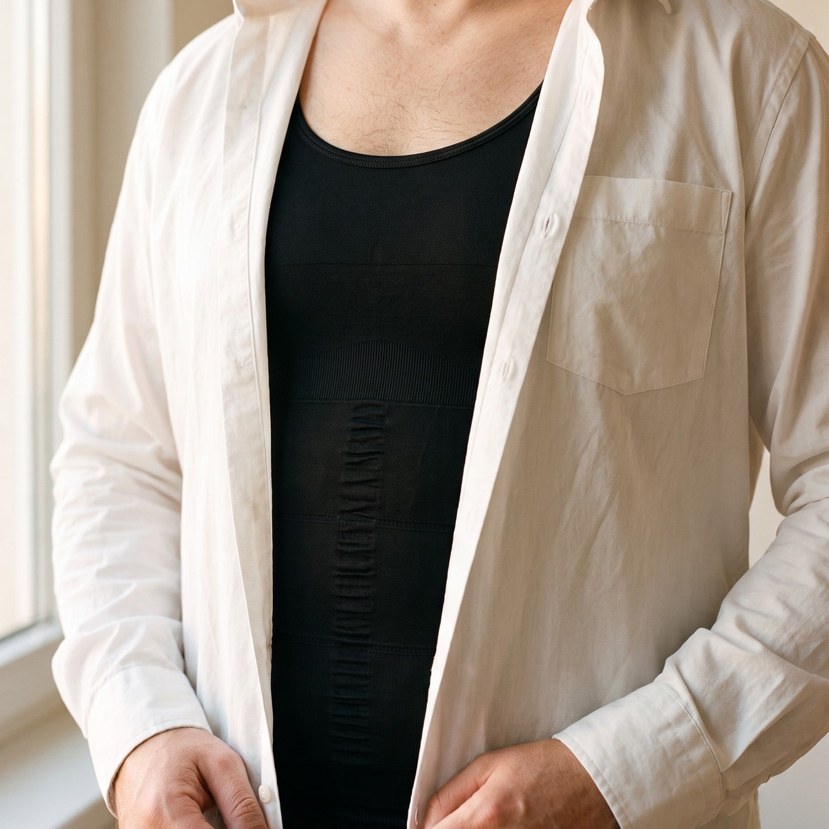 The tank worn under an open white shirt